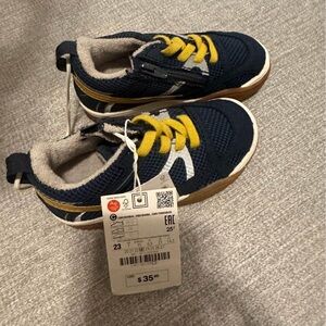 Toddler boys shoes size 7. Brand new! Never been worn! Navy and yellow